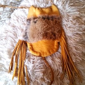 Leather bag with fur trim